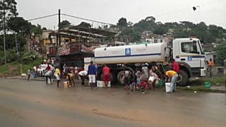 Residents of Bhambayi township in South Africa's eastern city of Durban protests against the lack of public services after floods cut water and electricity.