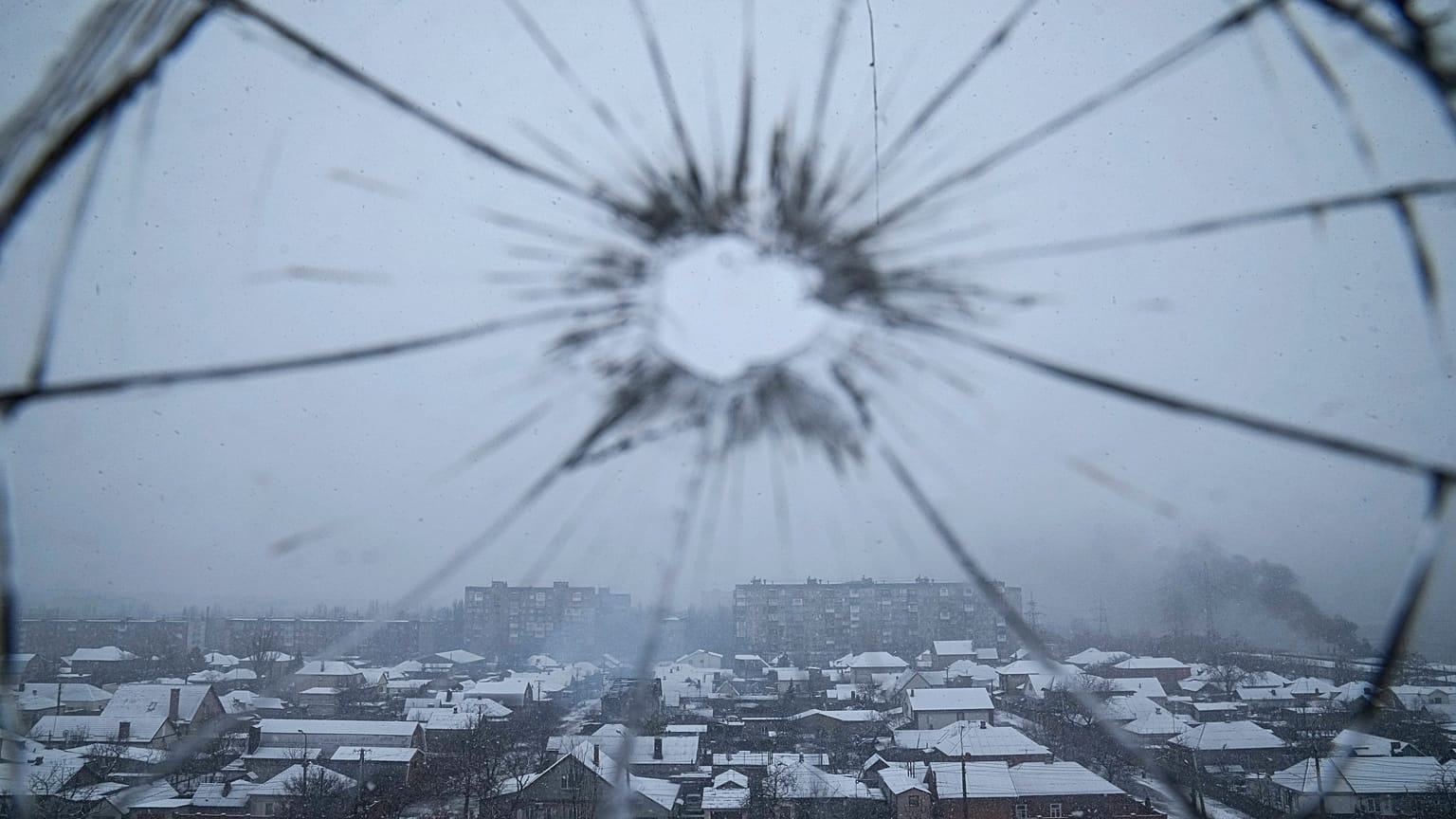 A hospital window is cracked from shelling in Mariupol.