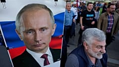 Sırbistan'ın başkenti Belgrad'taki Rusya'ya destek protestosunda Putin posterleri taşındı