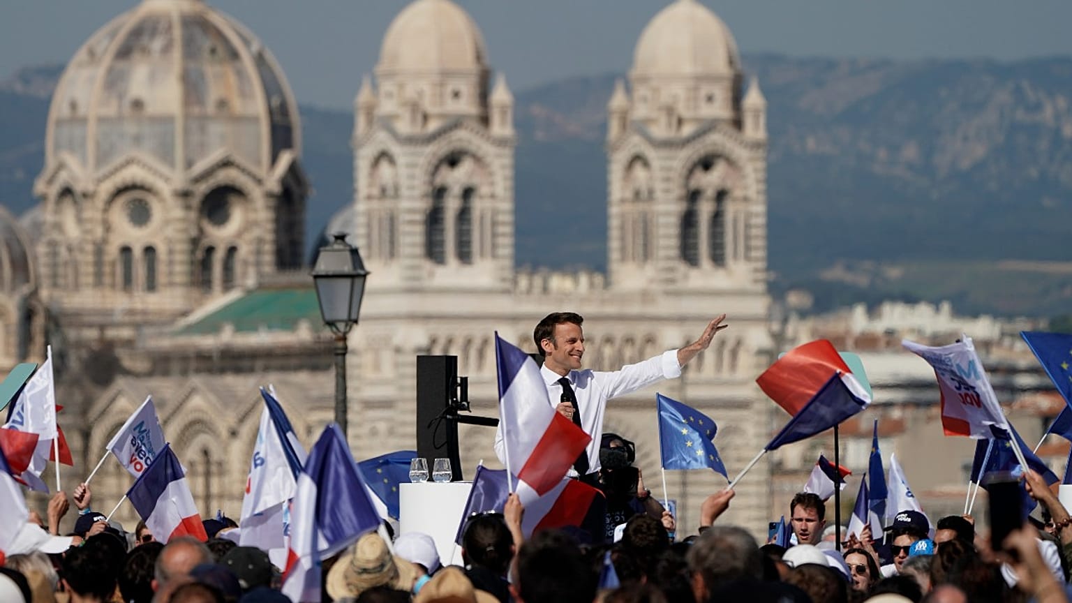 French President and centrist candidate Emmanuel Macron waves during a campaign rally, Saturday, April 16, 2022 in Marseille, southern France.