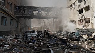 Firefighters working to extinguish fires after a Russian strike in Kharkiv.