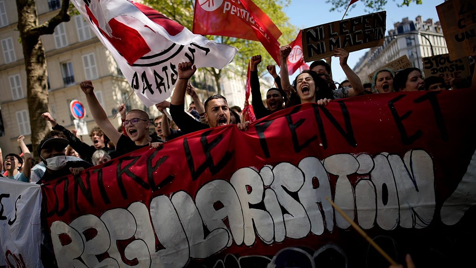 Demonstrators hold a banner reading: Against Le Pen, during a protest against far-right in Paris, Saturday, April 16, 2022. 