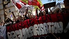 Demonstrators hold a banner reading: Against Le Pen, during a protest against far-right in Paris, Saturday, April 16, 2022. 