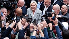 French far-right leader and presidential candidate Marine Le Pen campaigns, Monday, April 18, 2022 in Saint-Pierre-en-Auge, Normandy. 