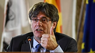 Catalan leader Carles Puigdemont speaks at a press conference in Alghero, Sardinia in October 2021