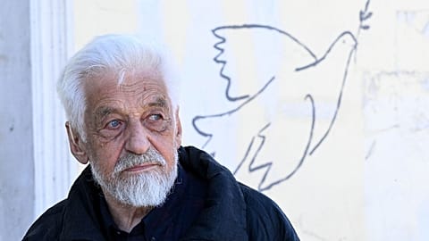 Despite being fined by the authorities and having his work painted over, Russian artist Vladimir Ovchinnikov is determined to continue his art calling for peace