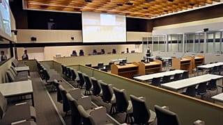 The trial is being held in a special courtroom inside former NATO offices in Brussels.