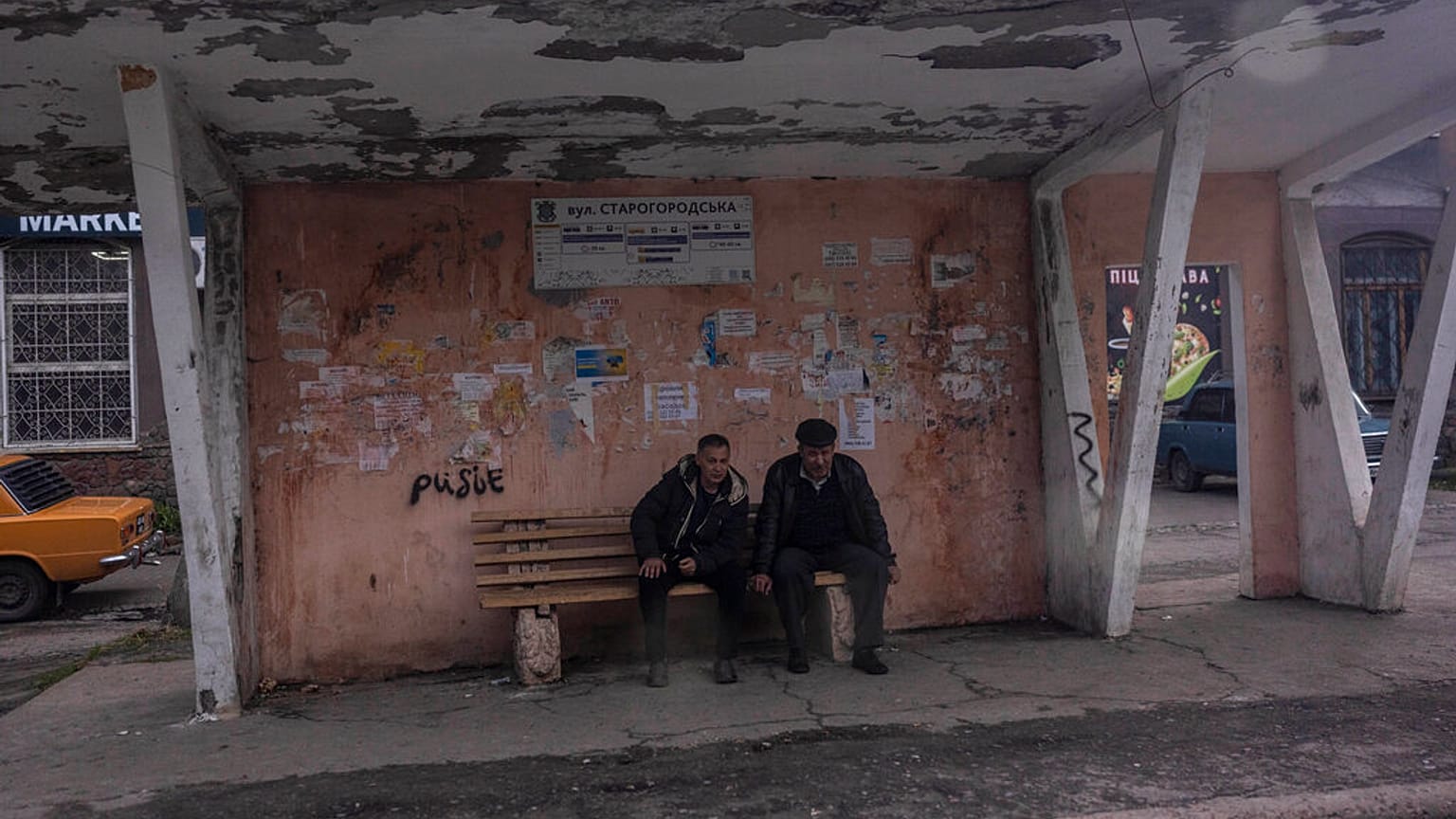 People wait at a bus station in Kramatorsk, Ukraine, Friday, April 15, 2022.