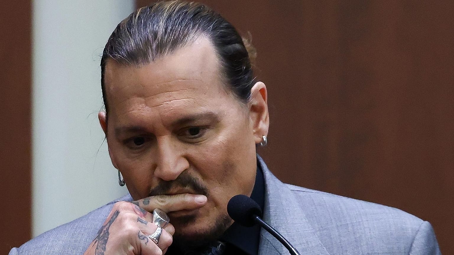 Actor Johnny Depp testifies during a hearing in the courtroom at the Fairfax County Circuit Court in Fairfax, Va., Wednesday, April 20, 2022.