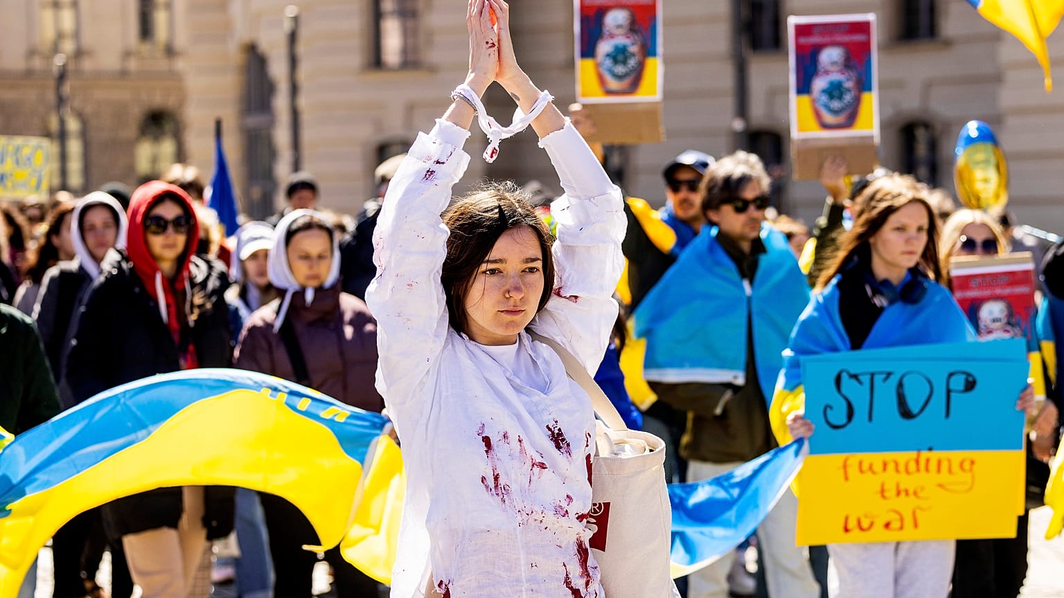 People attend a pro-Ukrainian protest under the slogan "March for true Peace in Ukraine", in Berlin, Germany, Saturday, April 16, 2022. 