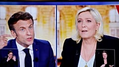 Emmanuel Macron and Marine Le Pen challenge each other during their TV debate on French TV channels TF1 and France 2, in Saint-Denis, near Paris, April 20, 2022.