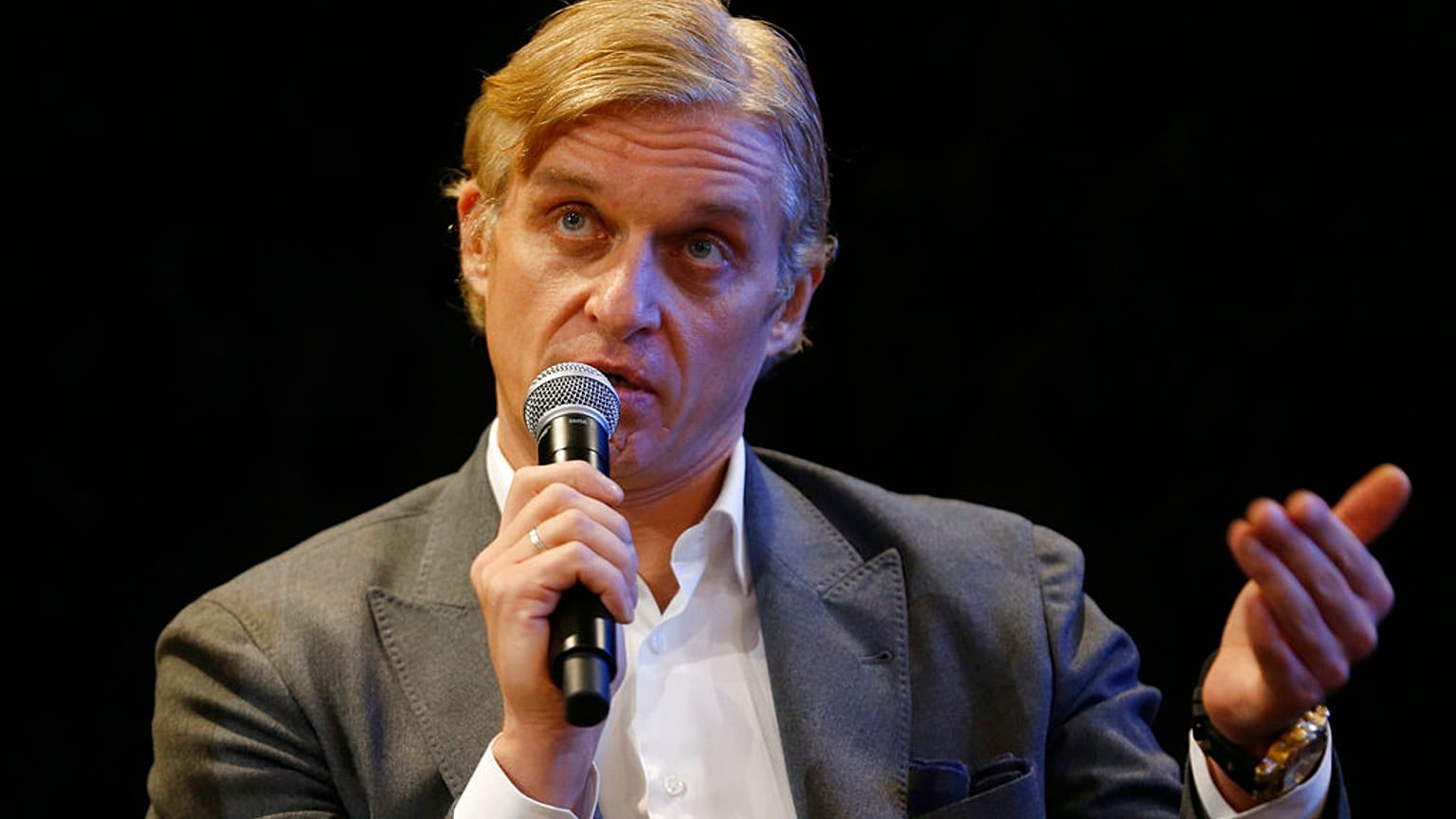Team owner Oleg Tinkov speaks to the media during a Tinkoff-Saxo cycling team press conference in London