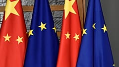 EU and Chinese flags are seen at the Europa building in Brussels, Dec. 17, 2019. 