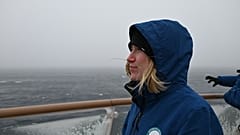 Global Choices' Emma Wilkinson looks out from a ship on the Antarctic expedition. 