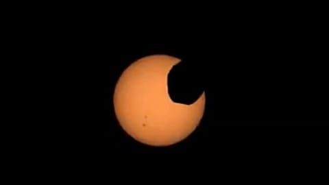 NASA’s Perseverance Mars rover captured footage of Phobos, one of Mars’s two moons, crossing the face of the sun on April 2, NASA said.