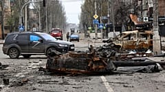A part of a destroyed tank and a burned vehicle sit in an area controlled by Russian-backed separatist forces in Mariupol, Ukraine, Saturday, 23 April, 2022.
