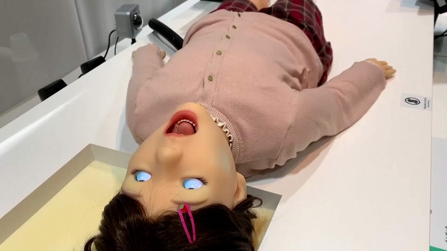 Image show the Pedia_roid robot which has been designed to mimic children's medical emergencies to help train dental workers.