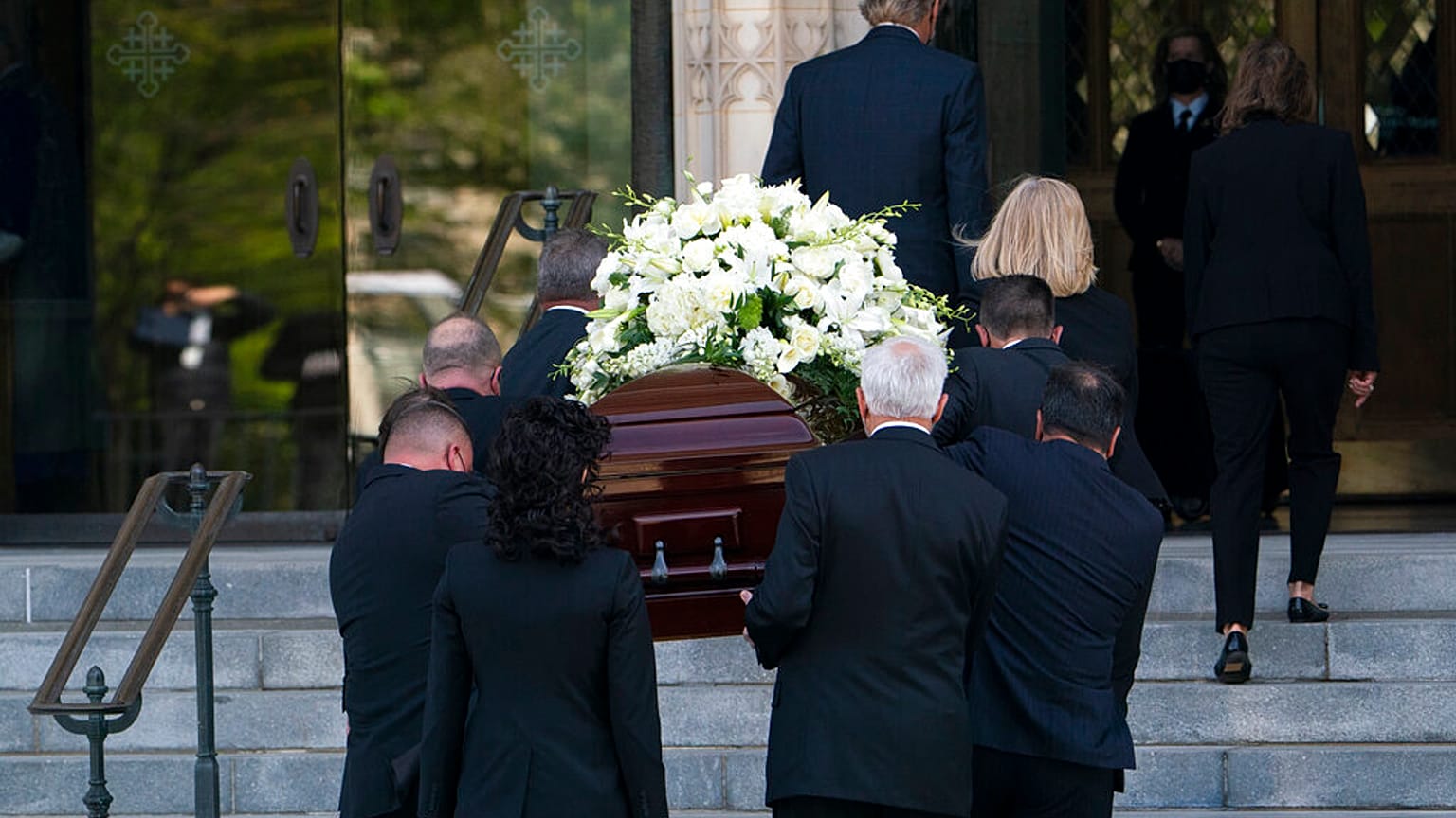 The casket of former Secretary of State Madeleine Albright is carried into the Washington National Cathedral for a funeral service in Washington