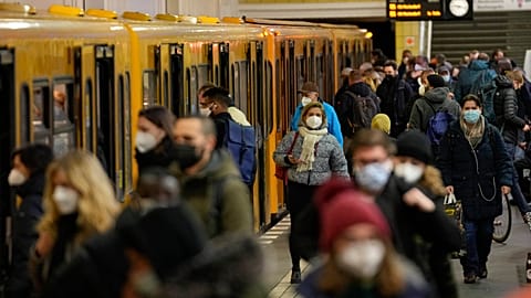 People wear face mask to protect against the coronavirus at the public transport station Friedrichstrasse in Berlin, Germany, Tuesday, November 30, 2021. 