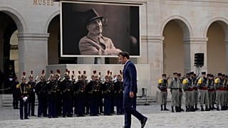 French President Emmanuel Macron walks during a national homage to late French actor Michel Bouquet