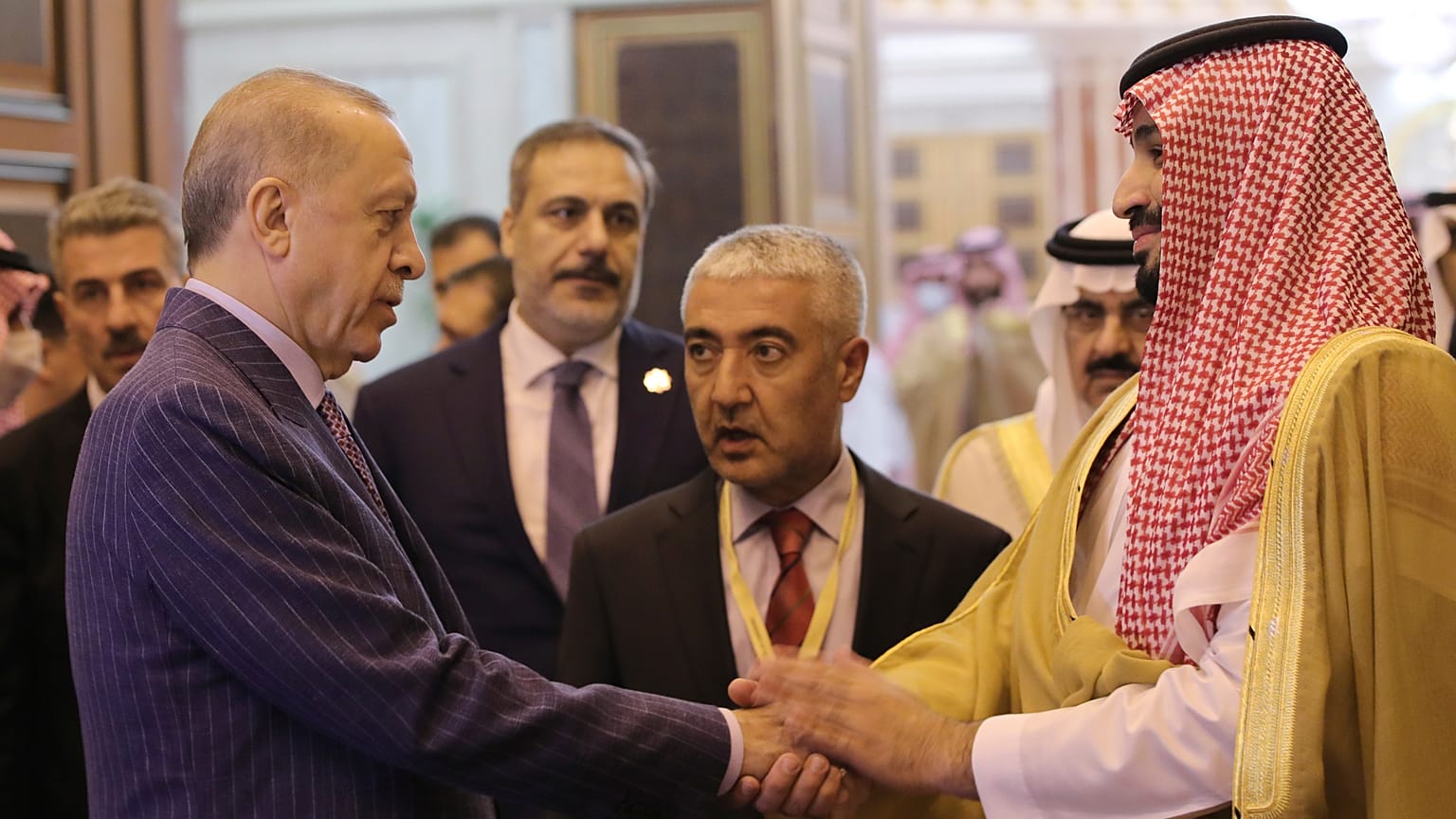 Turkish President Recep Tayyip Erdogan, left, and Saudi Arabia's Crown Prince Mohammed bin Salman speak after their meeting in Jiddah, Saudi Arabia, Friday, April 29, 2022.