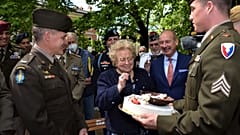 The cake was presented to 90-year-old Meri Mion by soldiers from US Army Garrison Italy.