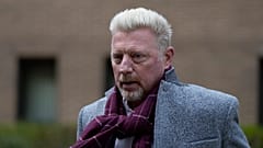 Former tennis player Boris Becker, right, leaves Southwark Crown Court in London on 7 April 2022