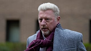 Former tennis player Boris Becker, right, leaves Southwark Crown Court in London on 7 April 2022