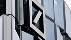 The Deutsche Bank bank logo is seen on the bank's headquarters in Frankfurt.