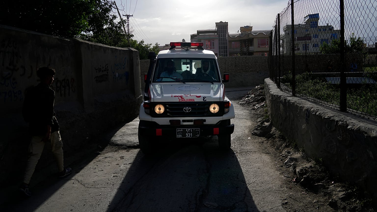 An ambulance carrying wounded people leaves the site of an explosion in Kabul.
