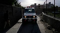 An ambulance carrying wounded people leaves the site of an explosion in Kabul.