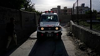 An ambulance carrying wounded people leaves the site of an explosion in Kabul.