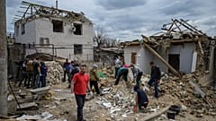 Residents and rescue workers secure homes after a shelling attack in Zaporizhzhia.
