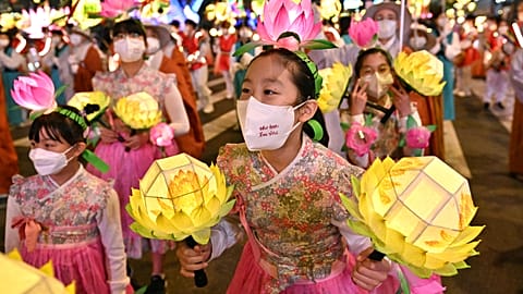 Participants march during a lantern parade to celebrate the upcoming Buddha's birthday, in Seoul.