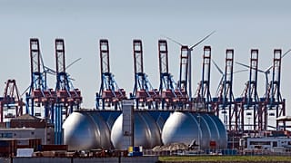 Tanks for producing bio gas are pictured at the harbor in Hamburg in April 2022