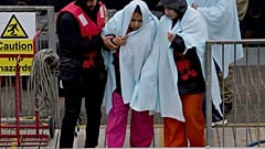 A group of people thought to be migrants are brought in to Dover, Kent, following a small boat incident in the English Channel, Monday May 2, 2022.