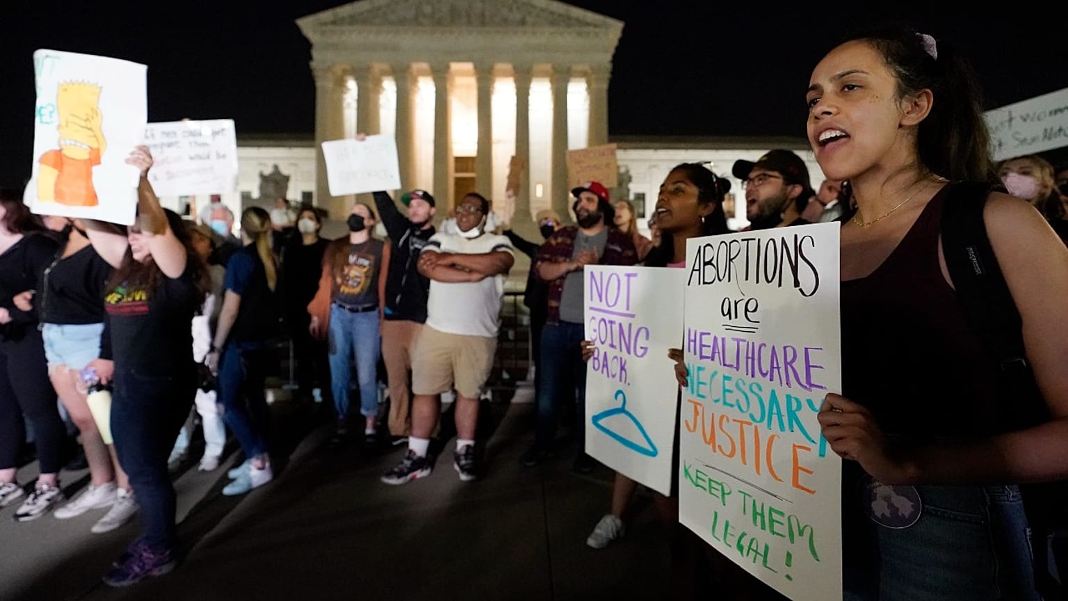 A crowd of people gather outside the Supreme Court, early Tuesday, May 3, 2022 in Washington.