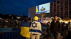 People gather in Tel Aviv to watch an address by Ukrainian President Volodymyr Zelenskyy in March.