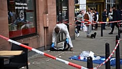 FILE --Forensics work at the scene where a man died after being stopped by police in Mannheim, Germany, Monday, May 2, 2022.