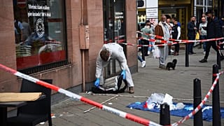 FILE --Forensics work at the scene where a man died after being stopped by police in Mannheim, Germany, Monday, May 2, 2022.
