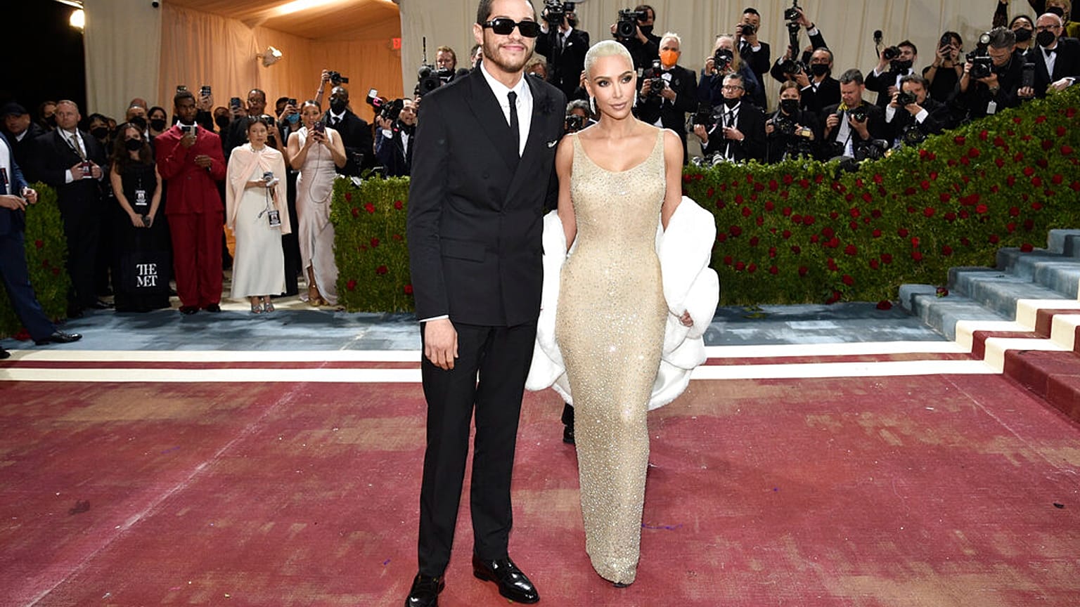 Kim Kardashian, right, wears a 1962 gown created for Marilyn Monroe at the Metropolitan Museum of Art's Costume Institute benefit gala on Monday