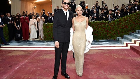 Kim Kardashian, right, wears a 1962 gown created for Marilyn Monroe at the Metropolitan Museum of Art's Costume Institute benefit gala on Monday