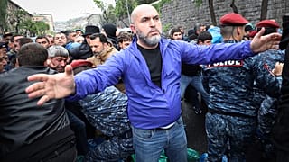 Police clash with demonstrators during a protest rally, in Yerevan, Armenia, Monday, May 2, 2022.