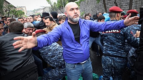 Police clash with demonstrators during a protest rally, in Yerevan, Armenia, Monday, May 2, 2022.