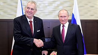 Russian President Vladimir Putin, right, shakes hands with Czech Republic President Milos Zeman in the Black Sea resort of Sochi, Russia, Nov. 21, 2017.