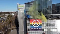 Greenpeace activists hang anti-war banner on power firm Fortum`s HQ