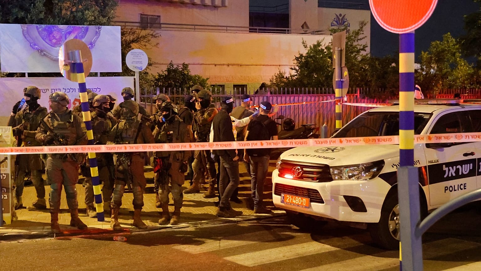 Israeli security forces are pictured at the scene of an attack in the cetral city of Elad, on May 5, 2022. 