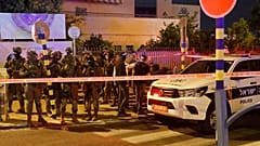 Israeli security forces are pictured at the scene of an attack in the cetral city of Elad, on May 5, 2022. 