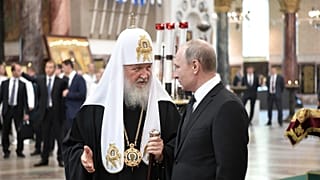 Russian President Vladimir Putin (R) and Russian Orthodox Patriarch Kirill in the Naval Cathedral in Kronshtadt, July 30, 2017.