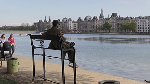 An overly tall bench installed on the river bank in Copenhagen